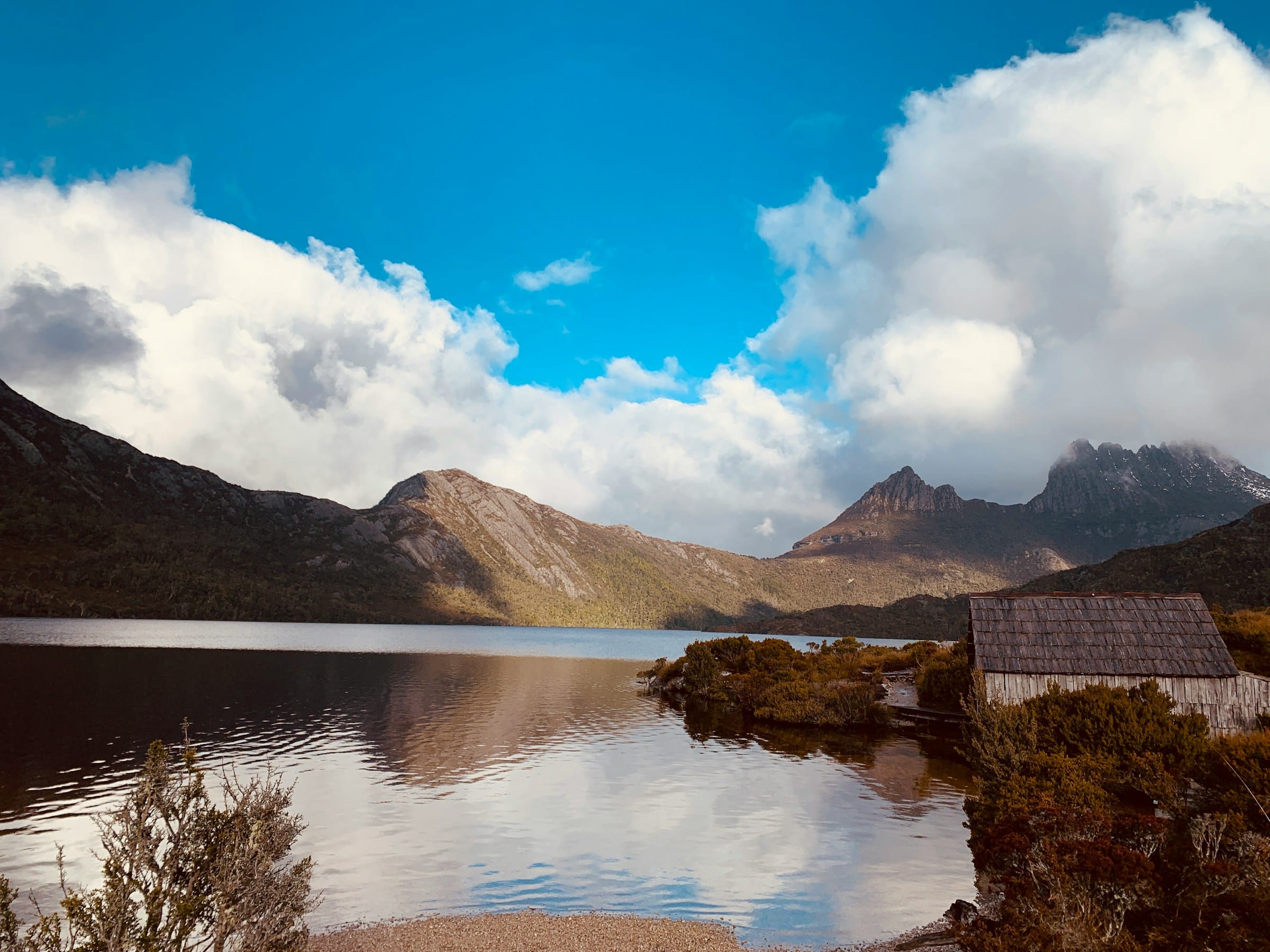 Cradle Mountain with hut and water in foreground