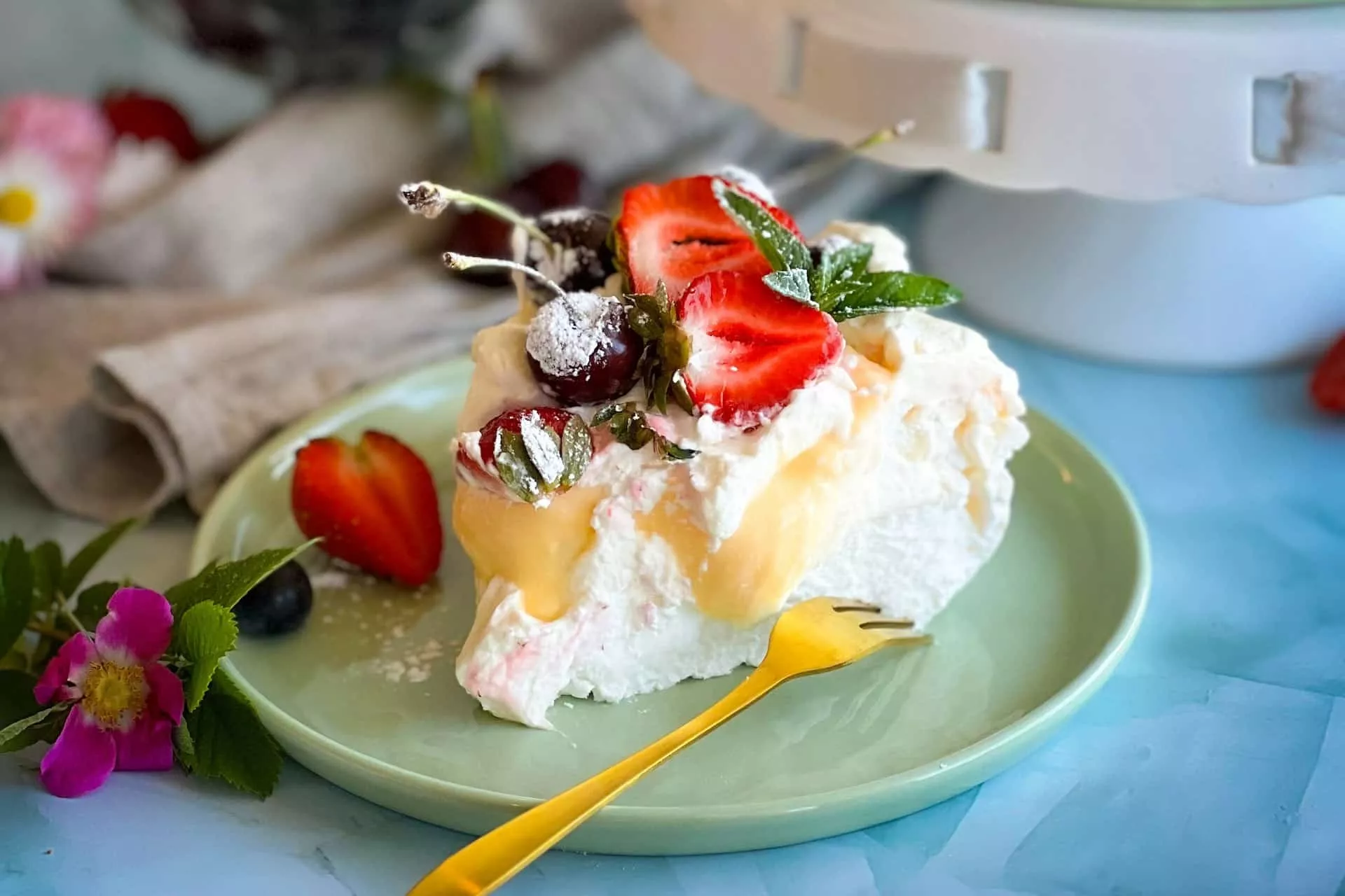 A slice of pavlova with strawberries