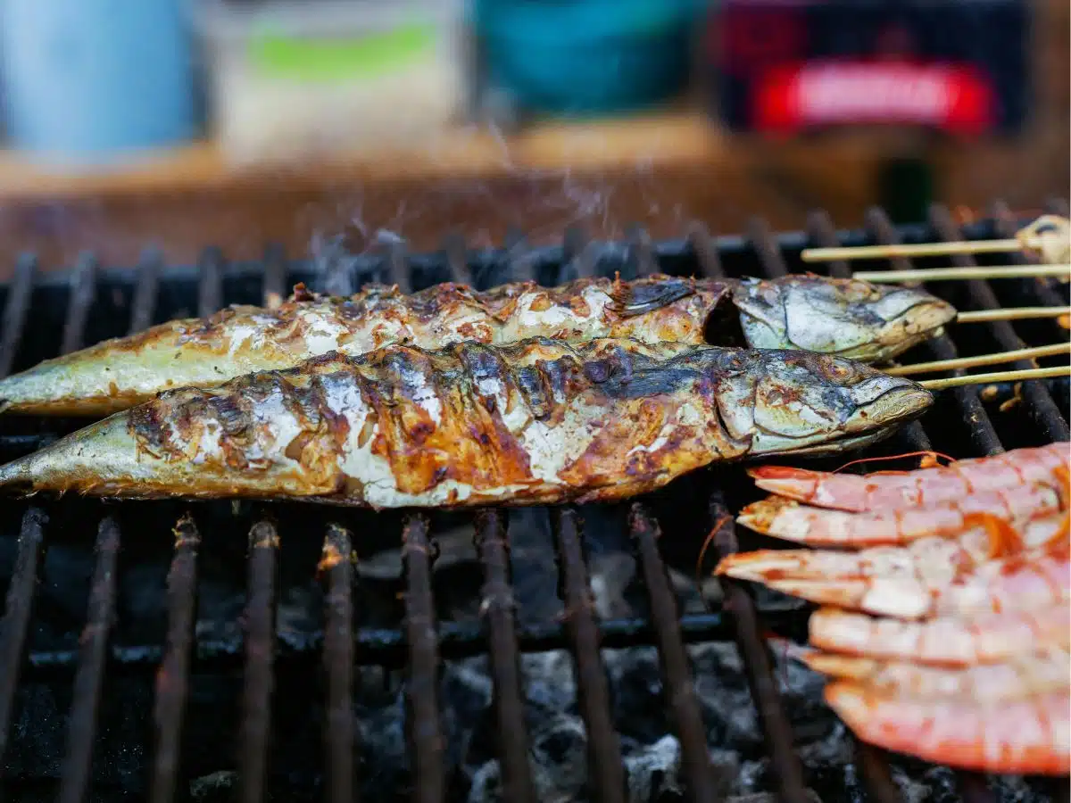 Fish sizzling on a BBQ.