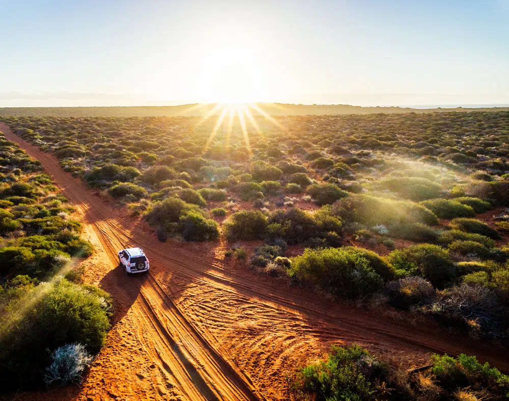 Driving off-road in Western Australia at sunset